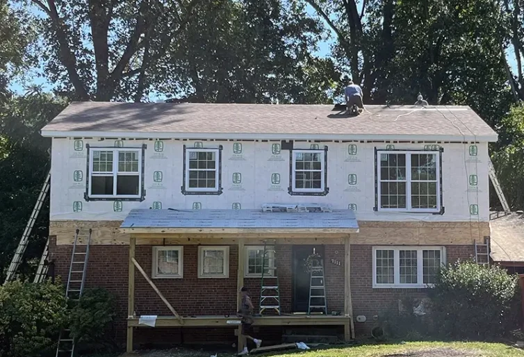 Men working on roof modular addition springfield